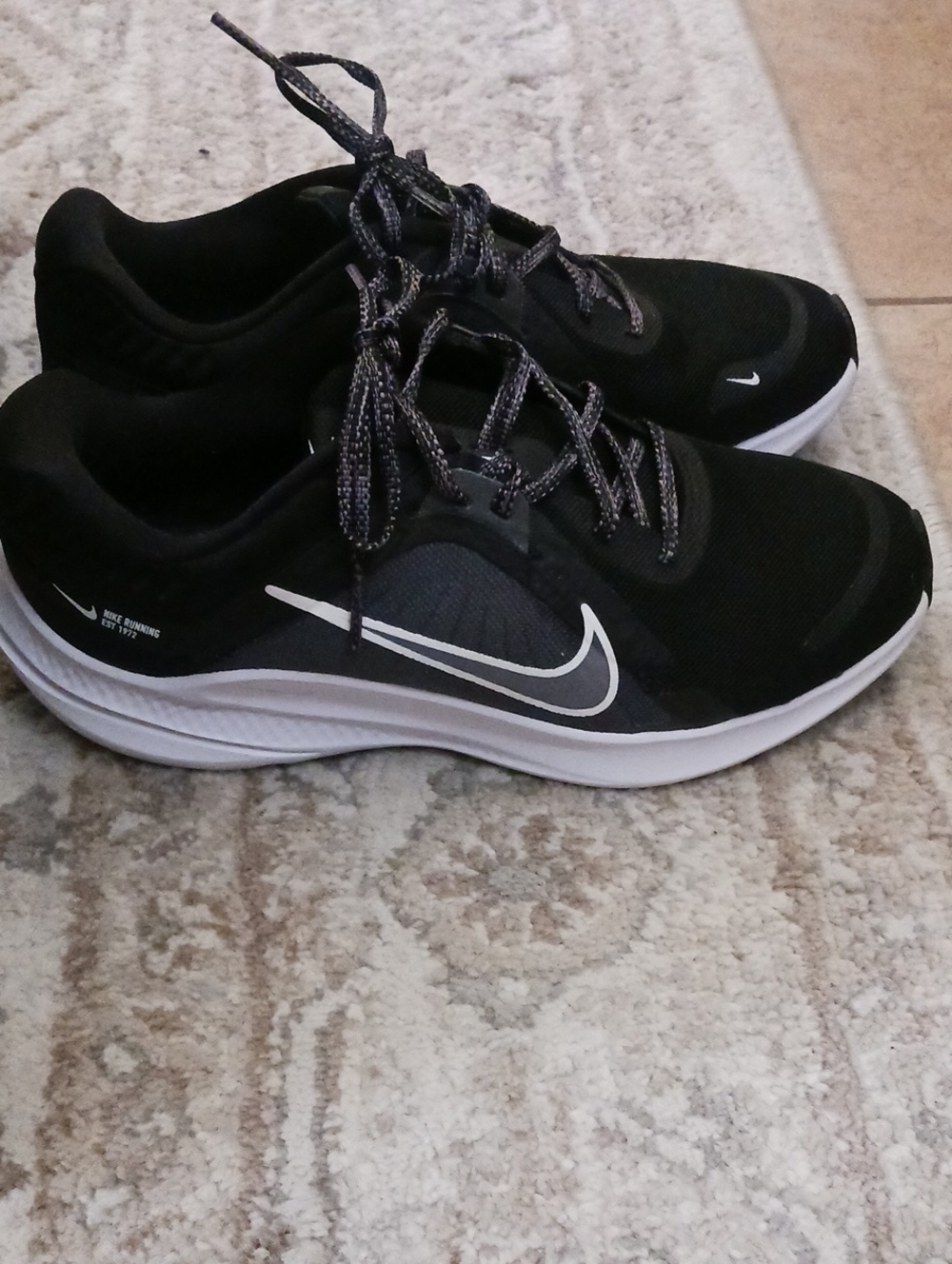 Nike Black Running Shoes with White Swoosh